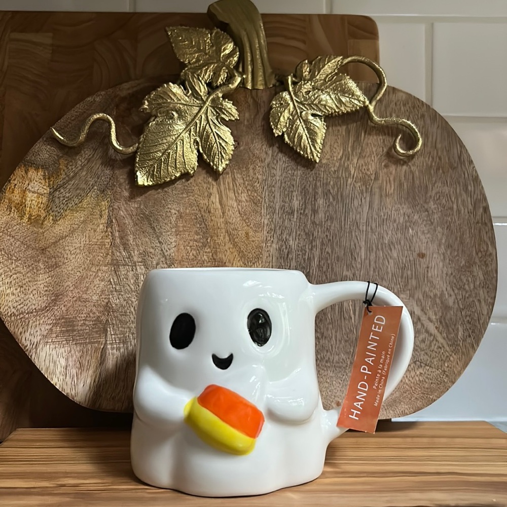 Ghost holding candy corn mug